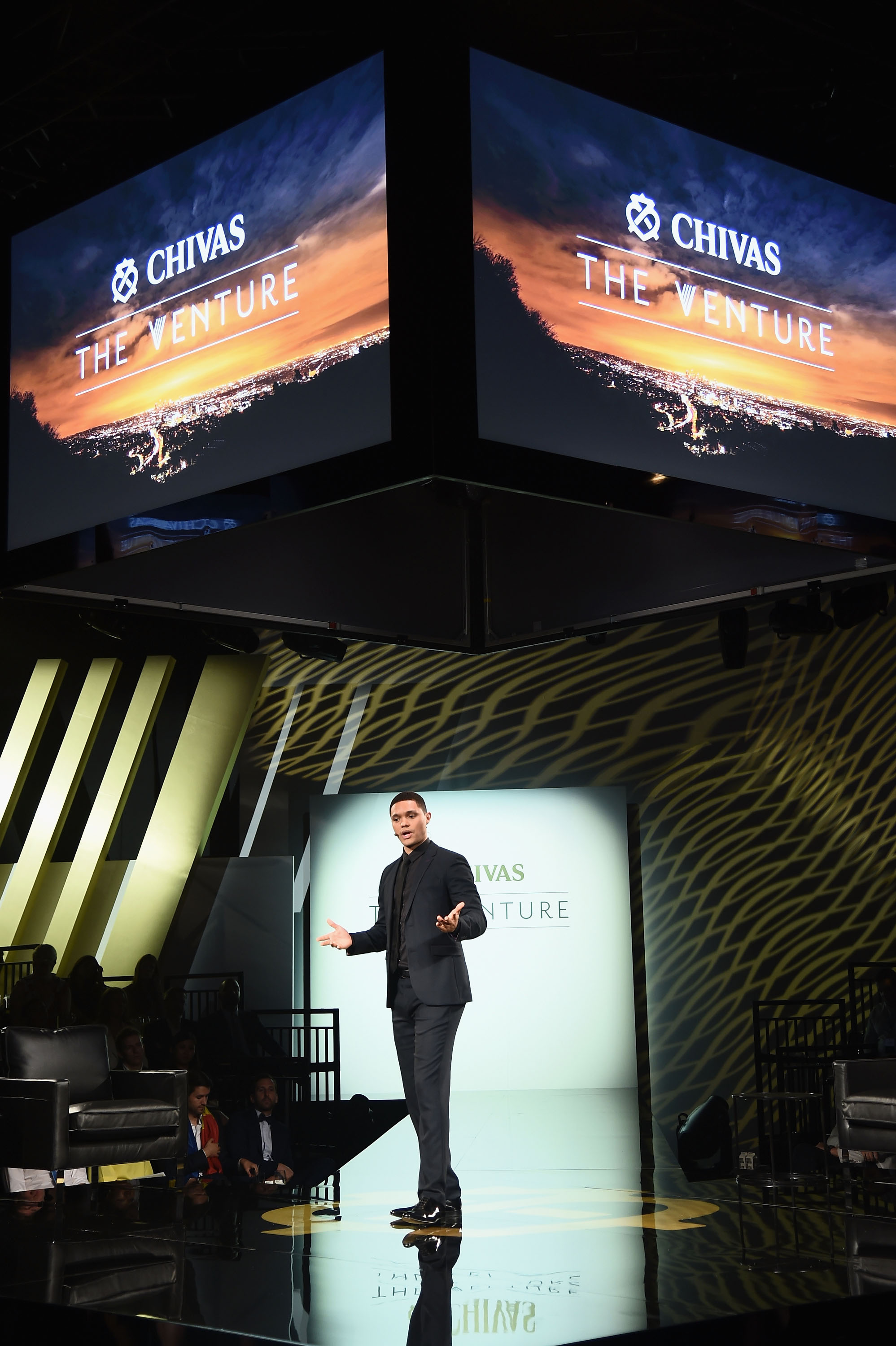 NEW YORK, NY - JULY 14:  Host Trevor Noah on stage at Chivas' The Venture Final Event on July 14, 2016 in New York City.  (Photo by Michael Loccisano/Getty Images for Chivas The Venture) *** Local Caption *** Trevor Noah